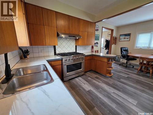 205 Warwick Street, Neville, SK - Indoor Photo Showing Kitchen With Double Sink