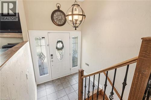 Entryway featuring a white door with an oval leaded glass insert, flanked by two sidelights with decorative leaded glass - 2207 Jester Court, Burlington, ON - Indoor Photo Showing Other Room