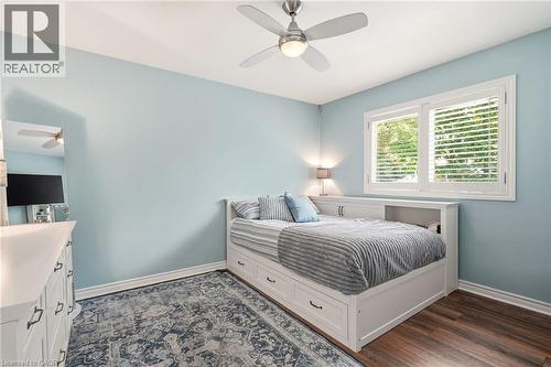 Bright interior with wood-finish flooring and light blue walls - 2207 Jester Court, Burlington, ON - Indoor Photo Showing Bedroom