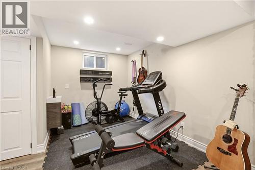 Finished lower level room featuring recessed lighting, a window, and a white interior door - 2207 Jester Court, Burlington, ON - Indoor Photo Showing Gym Room
