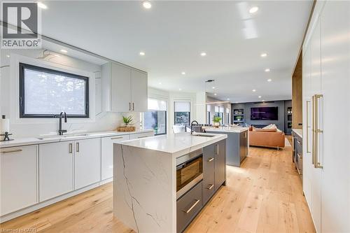 Modern kitchen featuring light wood-finish flooring and recessed lighting - 54 Deerview Avenue, Ancaster, ON - Indoor Photo Showing Kitchen With Upgraded Kitchen