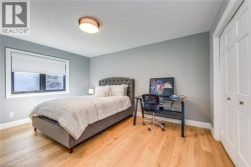 Bedroom featuring light-colored wood-finish flooring and a neutral wall color - 54 Deerview Avenue, Ancaster, ON - Indoor Photo Showing Bedroom