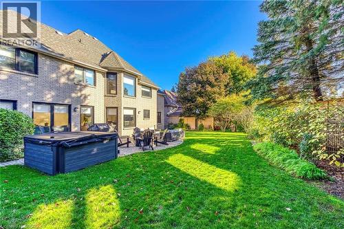 Expansive green lawn with mature trees and established landscaping - 54 Deerview Avenue, Ancaster, ON - Outdoor