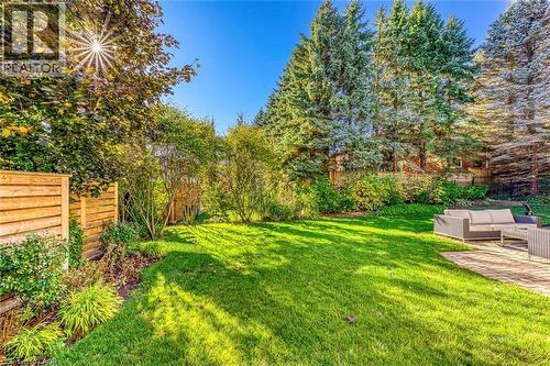 Expansive green lawn surrounded by mature trees and shrubs - 54 Deerview Avenue, Ancaster, ON - Outdoor