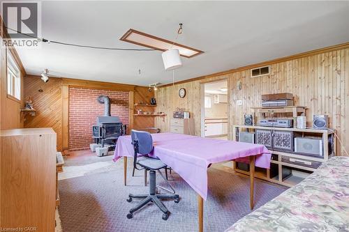 Interior space featuring wood-paneled walls and wall-to-wall carpeting - 186 Adeline Avenue, Hamilton, ON - Indoor
