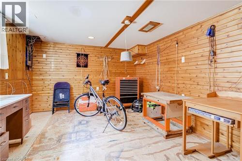 Utility room featuring horizontal wood paneling, recessed lighting, and exposed ceiling beams - 186 Adeline Avenue, Hamilton, ON - Indoor Photo Showing Other Room