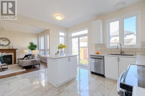 110 Macara Crescent, Ottawa, ON - Indoor Photo Showing Kitchen With Fireplace