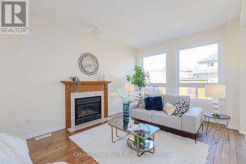 Family room with fireplace - 110 Macara Crescent, Ottawa, ON - Indoor Photo Showing Living Room With Fireplace