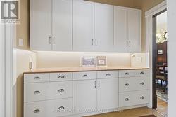 Main Floor: Pantry Storage Adjacent to Kitchen - 