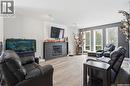 165 3Rd Street, Pilot Butte, SK  - Indoor Photo Showing Living Room With Fireplace 