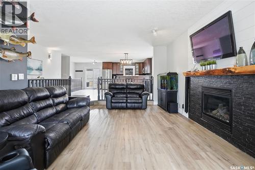 165 3Rd Street, Pilot Butte, SK - Indoor Photo Showing Living Room With Fireplace