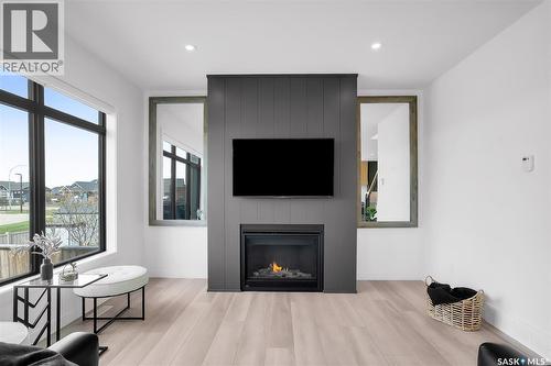 255 Greyeyes-Steele Way, Saskatoon, SK - Indoor Photo Showing Living Room With Fireplace