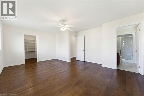 Spacious room featuring wood-finish flooring and bright white walls - 6 General Street, Brantford, ON - Indoor Photo Showing Other Room