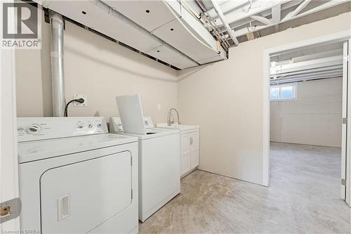 Dedicated laundry area featuring a utility sink with white cabinetry - 6 General Street, Brantford, ON - Indoor Photo Showing Laundry Room