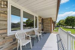 Lovely front south facing window and covered porch - 