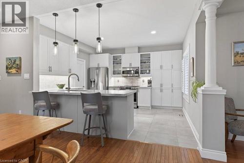 Professionally painted cabinetry, recent quartz counter tops - 100 Beddoe Drive Unit# 101, Hamilton, ON - Indoor Photo Showing Kitchen With Upgraded Kitchen