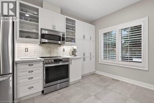 Induction cooktop stove. Lots of cupboards & cabinetry - 100 Beddoe Drive Unit# 101, Hamilton, ON - Indoor Photo Showing Kitchen