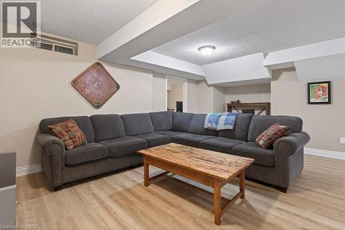 updated flooring in Rec room - 100 Beddoe Drive Unit# 101, Hamilton, ON - Indoor Photo Showing Living Room
