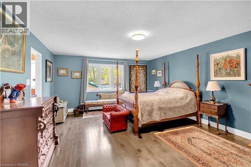 Hardwood-finish flooring, ample natural light from multiple windows, and a neutral color palette - 69 Hunter Way, Brantford, ON - Indoor Photo Showing Bedroom