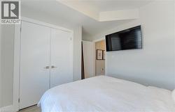 Double-door closet with square brushed nickel hardware - 