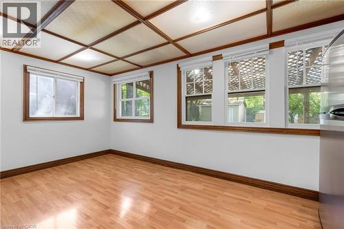 Room featuring wood-finish flooring, white walls, and a wood-beamed coffered ceiling - 168 Britannia Avenue, Hamilton, ON - Indoor Photo Showing Other Room