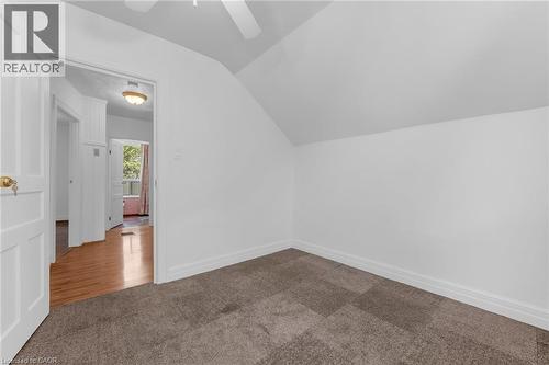 Room featuring sloped ceilings, neutral wall paint, and wall-to-wall carpeting - 168 Britannia Avenue, Hamilton, ON - Indoor Photo Showing Other Room
