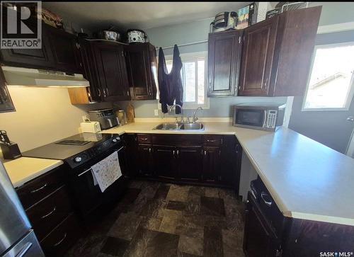 114 7Th Avenue S, Big River, SK - Indoor Photo Showing Kitchen With Double Sink