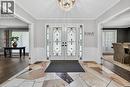 Grand entry featuring double doors with decorative ironwork and sidelights - 25 Braemar Place, Hamilton, ON  - Indoor Photo Showing Other Room 
