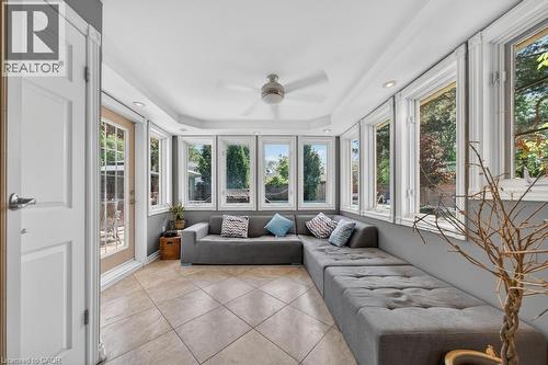 Sunroom featuring a full wall of windows, recessed lighting, a ceiling fan, and tile flooring - 25 Braemar Place, Hamilton, ON - Indoor Photo Showing Other Room