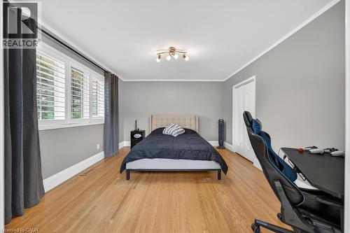 Room featuring hardwood flooring and light gray walls - 25 Braemar Place, Hamilton, ON - Indoor