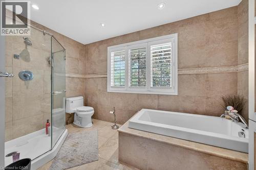 Contemporary bathroom featuring a built-in soaking tub and a glass-enclosed shower - 25 Braemar Place, Hamilton, ON - Indoor Photo Showing Bathroom