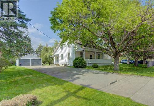 White siding residence with a covered porch - 1463 Kossuth Road, Cambridge, ON - Outdoor