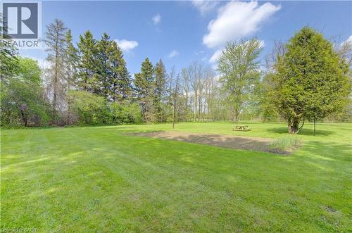 Expansive green lawn with a defined garden bed - 1463 Kossuth Road, Cambridge, ON - Outdoor