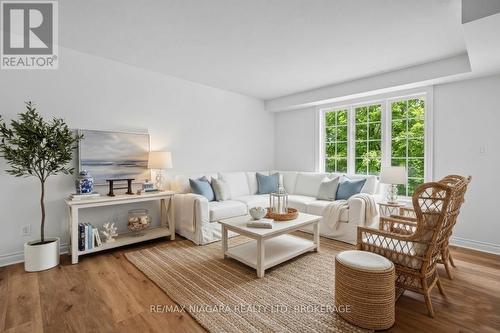 Living room (virtually staged) - 202 - 250 Linwell Road, St. Catharines (Lakeport), ON 