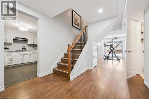 Interior features wood-finish flooring throughout the main level - 488 Heather Hill Place, Waterloo, ON - Indoor