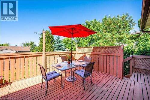 Spacious wood-decked patio with protective railings and privacy lattice - 488 Heather Hill Place, Waterloo, ON - Outdoor With Deck Patio Veranda With Exterior