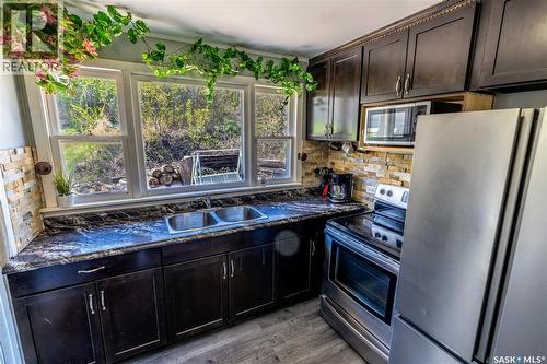 1041 Tatanka Drive, South Lake, SK - Indoor Photo Showing Kitchen With Double Sink