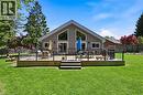 Expansive backyard featuring a large wood-finish deck with glass panel railing - 24 Glenwood Crescent, Hamilton, ON  - Outdoor 