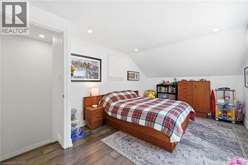 Room featuring sloped ceiling, recessed lighting, and wood-finish flooring - 24 Glenwood Crescent, Hamilton, ON - Indoor Photo Showing Bedroom
