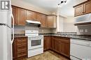 213 928 Heritage View, Saskatoon, SK  - Indoor Photo Showing Kitchen With Double Sink 