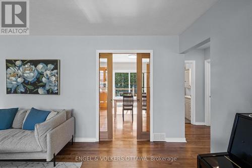 Sliding pocket doors into the kitchen - 1056 Hindley Street, Ottawa, ON - Indoor Photo Showing Living Room