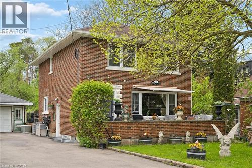 Brick two-story residence featuring a bay window with an awning and white trim - 786 S Stirling Avenue S, Kitchener, ON - Outdoor