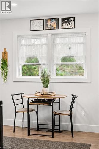 Recessed ceiling lighting illuminates a white wall with two windows featuring white trim - 786 S Stirling Avenue S, Kitchener, ON - Indoor Photo Showing Other Room