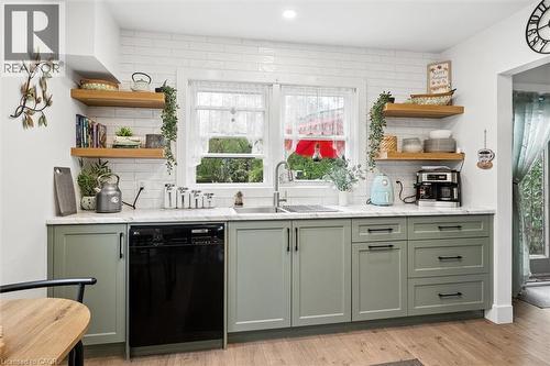 Kitchen featuring green shaker-style cabinetry, a built-in dishwasher, and a stainless steel sink - 786 S Stirling Avenue S, Kitchener, ON - Indoor Photo Showing Kitchen With Double Sink