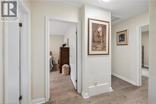 Hallway featuring wood-finish flooring, light-colored walls, white trim, and recessed lighting - 786 S Stirling Avenue S, Kitchener, ON - Indoor Photo Showing Other Room