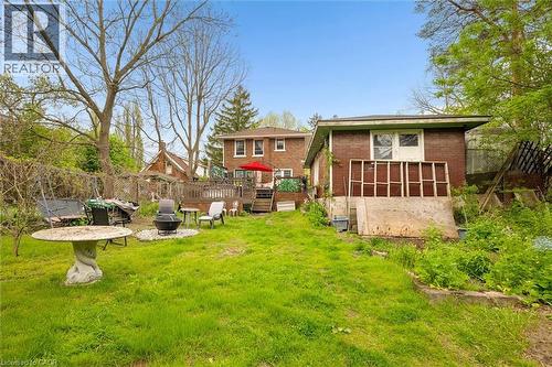 Expansive backyard featuring a lush lawn and established trees - 786 S Stirling Avenue S, Kitchener, ON - Outdoor
