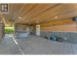 Covered area for additional outdoor dining or hot tub! - 