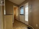 Entryway featuring tile flooring, a white door with an integrated window blind, and an adjacent sidelight window - 37 Northcliffe Crescent, Cambridge, ON  - Indoor Photo Showing Other Room 