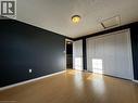 Room featuring wood-finish flooring and dark-painted walls - 37 Northcliffe Crescent, Cambridge, ON  - Indoor Photo Showing Other Room 