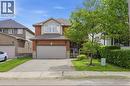 Brick exterior with stone accents and a two-car garage - 84 Duncairn Crescent, Hamilton, ON  - Outdoor With Facade 